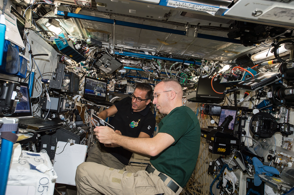 NASA astronauts Joe Acaba and Randy Bresnik shown here working inside the International Space Station in preparation for a spacewalk on October 20. The two will talk with students at Santa Monica High School in Santa Monica, California on Monday, Oct. 30 about living and working in space.
