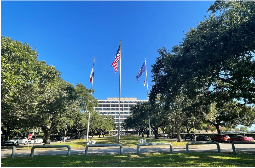 The Project Management Building with its four flagpoles at NASA’s Johnson Space Center in Houston, known today as Building 1, in November 2021. Credits: NASA