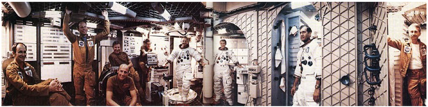 Skylab astronauts (from left) Alan L. Bean, Jack R. Lousma, Paul J. Weitz, Charles “Pete” Conrad, Joseph P. Kerwin, Gerald P. “Jerry” Carr, Edward G. Gibson, William R. Pogue, and Owen K. Garriott inside the Skylab 1-G trainer. Credits: NASA