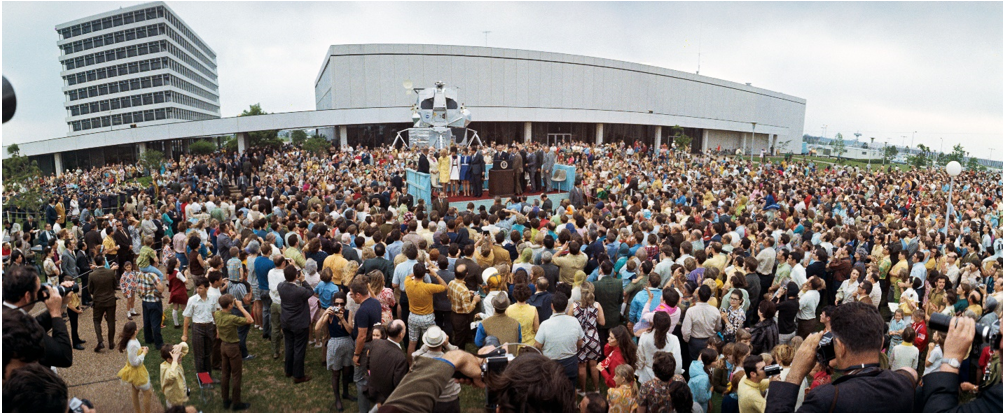 In front of the auditorium building, President Richard M. Nixon present medals to mission operations personnel for their work in getting the crew of Apollo 13 home safely in April 1970. Credits: NASA