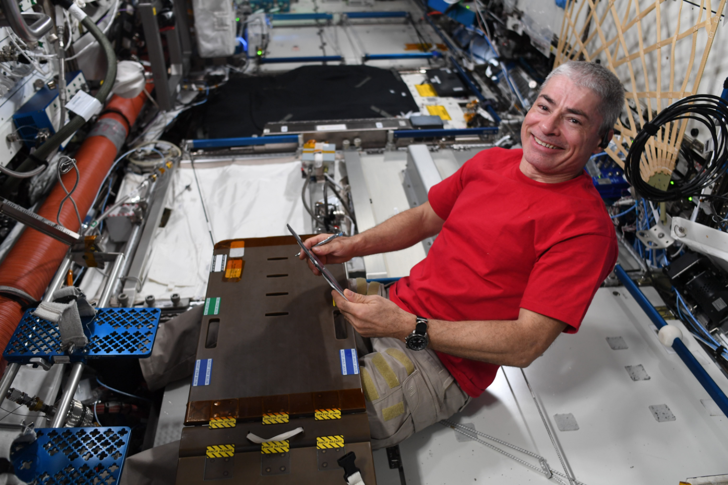 Aboard the International Space Station, NASA astronaut Mark Vande Hei squeezes in time to unwind with a book. Vande Hei made it into record books on March 15, 2022, breaking the record for the most consecutive days in space by an American explorer. Credits: NASA/ESA/T. Pesquet