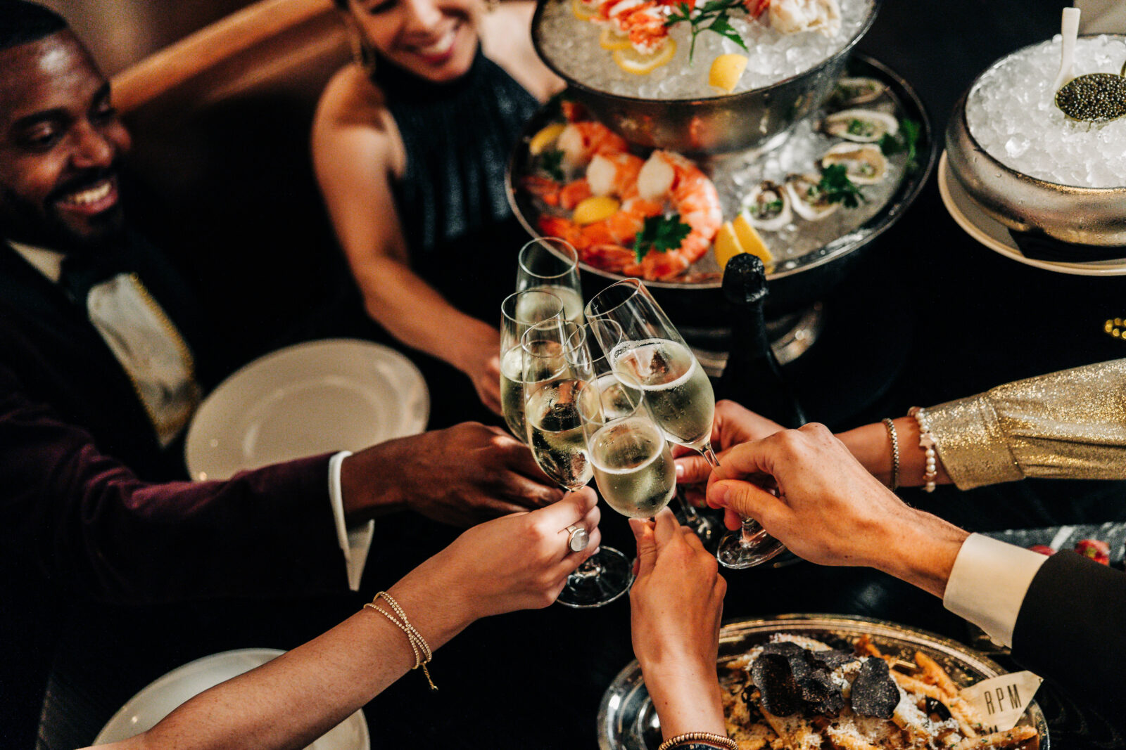 Guests doing a toast at a holiday event.