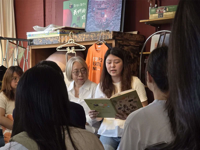 Sisterhood Publishes "No Cloth on the Island" Discussing Intergenerational Struggles in Immigrant Families; New Immigrants Read to Tears