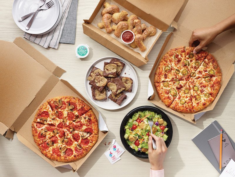 The future of fast delivery? Domino’s delivers pizza by jetpack as Elton John headlines Glastonbury Festival