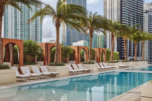 Beat the Heat: Epic Pool to Cool Down in Miami
In dire need of a relaxing, pool day surrounded by Brickell’s gorgeous skyline? Consider it done. Sophisticated interiors, original works of art by contemporary masters, and a lux garden-level pool terrace designed to inspire style beyond compare.
The expansive 9th-floor terrace features a 75-foot lap pool and a separate 112-foot beach entry pool with poolside cabanas and shaded lounge areas. The poolside bar has live entertainment, a TV, and al fresco dining. The SLS LUX has crafted a detail-oriented experience that ensures all hotel guests feel like VIPs.
