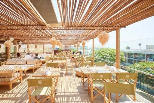 LouLou Rooftop Restaurant & Lounge
Cosmopolitan rooftop where you can escape to the French Riviera with a California twist.
Perched on top of Santa Monica Place, the modern and cosmopolitan LouLou Rooftop Restaurant & Lounge transports you from the heart of Santa Monica to the French Riviera.
In a beautiful setting, where the Mediterranean meets Bali, the bright, lush and natural rooftop mixes light wood tables and comfy lounge sofas. All surrounded with the amazing California sunsets and ocean views.
The LouLou Santa Monica menu showcase French Mediterranean flavors with a classic California twist, while honoring the generosity of artisanal and homemade ingredients, as well as local organic produce.
The food is complemented with a carefully selected array of wines from both France and California, as well as colorful and crafted specialty cocktails and classics.