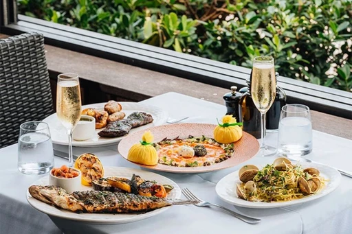 The best brunch in Miami - Jaya at the Setai
At Jaya, the tables spread out in a charming open-air courtyard surrounding the pool. On Sundays, there’s a jazz band on a stage right there in the middle of the water. You’ll see people in their best flowy dresses and sports jackets.
The food, from executive chef Vijayudu Veena, is far from the standard fare, with everything from Indian to Indonesian, and was recently updated to include Peking duck and grilled-to-order stations. The drinks are, of course, endless: The $105 price includes bottomless champagne, white wine, rośe and a mojito bar.
