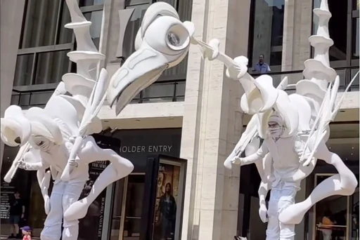 BIRDMEN staying hydrated at Lincoln Center 💦
“Birdmen” by Close-Act Theatre are three gigantic, stilt-walking puppets that roam the campus as part of the BigUmbrella Festival today and tomorrow, July 6 and 7, 2024. These clips were captured this morning. They will perform again today at 5 PM and tomorrow, July 7 at 4 pm and 7 pm.
Stay hydrated like the Birdmen!
