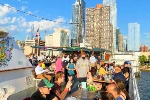 Hop Aboard NYC’s first-ever floating Mexican restaurant!
NYC’s First & Only Floating Mexican Restaurant Is Open On The Hudson. All aboard for some tequila and Mexican-inspired street food! La Barca Cantina has returned on the Hudson for another season.
La Barca Cantina offers Mexican fare and delicious cocktails afloat! Hop onboard the three-story boat at Pier 81 on the Hudson River and sail around the city for incredible skyline and sunset views with New York Cruise Lines. And it has officially set sail!
The boat offers custom artwork by Tlisza Jaurique, the first Mexican-American woman to exhibit at the Met, an incredible top deck for guests to take in the scenery, and most notably, an expansive agave-based spirits menu.