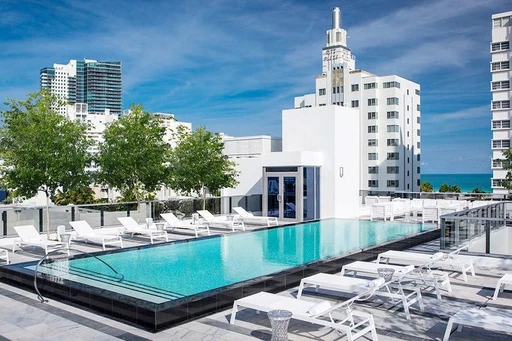 Gale South Beach Miami
Located just a block away from the sea, this spacious rooftop offers 5,000 square feet of tastefully furnished terrace, ready to welcome you day and night.
The Gale South Beach offers hotel guests a lovely pool area, with one of Miami's best rooftop pools, comfy sun loungers, private cabanas, and a well-stocked bar in which you can find all kinds of delicious drinks. You can also enjoy Italian bites from the ground floor restaurant.
Framed by black marble and heated, the rooftop pool offers a setting really suiting the terrace, which is filled with a comy and harmonius atmosphere. A true oasis from the busy streets below.
From time to time, the Gale South Beach rooftop is also available to the public, when the fantastic ground floor cocktail bar The Regent Cocktail Club host open-air rooftop events.