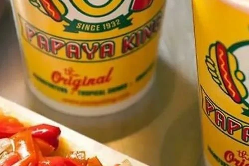 The iconic Papaya King has reopened on the Upper East Side!
Find it right across the street from its original location.
The beloved, iconic, uber-popular and downright delicious Papaya King has officially reopened on the Upper East Side at 206 East 86 Street by Third Avenue, right across the street from the brand's original address, which shuttered to much dismay after the owners of the building filed plans to demolish it.
The development, which was first reported by Upper East Site, has incited excitement all around town, with folks taking to social media to express their delight.