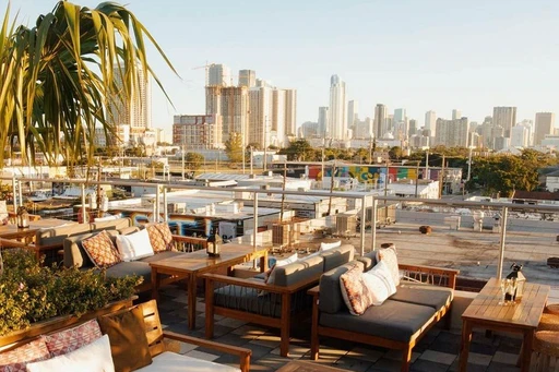 Spanning over 10,000-square-feet, the Astra Roof Garden in Wynwood is spacious and impressive, and just about as close to the Greek Islands as you can get in Miami.
Equipped with both dining tables and more comfy lounge sofas, here you are surrounded with lush Mediterranean plants and some fantastic and unobstructed views over the Miami skyline.
Open nightly for Greek and Mediterranean inspired F&B and a vibrant atmosphere, during Sunday's the vibes start early with a bottomless Miami rooftop brunch. Expect a mix of Oysters, Fried Calamari, Eggs Benedict, Mojito Pitchers and live DJs/entertainment. And try to stick around until sunset, as it is something special from the Astra rooftop.