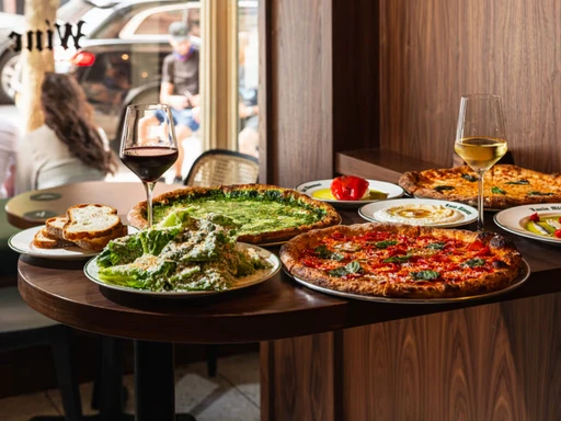 If you like excellent NY slices, you’ll love LUCIA ALIMENTARI!
Their tiny new sit-down alimentari located directly behind their Soho slice shop.
You can enjoy all of your favorite slices in personal pizza form, without too much of a wait—for now.