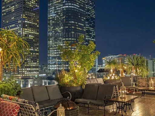 Perch LA with amazing views over the whole city or among the skyscrapers.
Located in downtown, and offering fantastic views of the entire city, Perch operates both as a bar and a bistro, making it an excellent choice for those looking for a place to eat and drink.
Offering both indoor and outdoor seating options as well as comfortable lounge furniture and a relaxed ambience, you'll be hard-pressed to find a more welcoming spot to watch the sunset while enjoying some drinks.
With classy furniture, lush plants, fire pits and fireplaces, and stylish decor that transports you straight to the French Riviera, Perch stands out in more ways than one; Here, you'll be able to shed your worries and the hustle and bustle of the city and enjoy the moment.