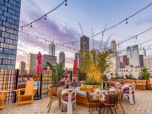 Broken Shaker is an elevated oasis in the heart of Downtown LA, located on top of the lovely Freehand Los Angeles.
Colorful, bright and buzzing, the rooftop comes surrounded with amazing and panoramic views over the Los Angeles skyline and the downtown area.
Open from noon to midnight, this is a venue to enjoy both sunny poolside hours, as well as fun filled evenings under the LA stars.
As a winner of Tales of the Cocktail’s Best American Hotel Bar award, it should be no surprise that Broken Shaker serves up delicious cocktails. While dips in the refreshing rooftop pool is reserved for guests staying at the hotel, anyone is welcome up to the rooftop for an abundance of drinks, vibes and views.