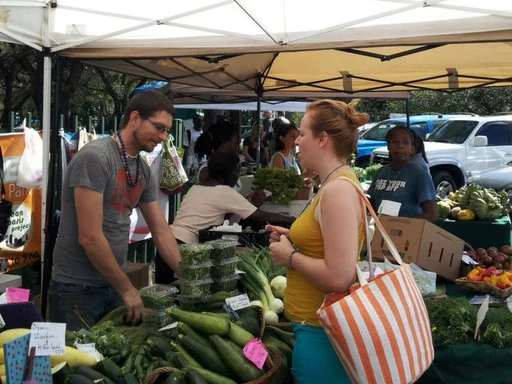 Legion Park Farmers’ Market
Legion Park is the place to be on a beautiful Saturday morning, as tents pop up from Biscayne Boulevard all the way to Biscayne Bay. Run by Urban Oasis Project, which oversees some of Miami’s most important farmers markets, you’ll find produce from local favorites like Little River Cooperative and French Farms, artisan-made goods like fresh breads, hummus and empanadas (the Chilean ones are excellent), and even dog treats. (Don’t worry, Fido always gets a free sample.)
In the morning, a hundred or so yogis gather under the Spanish-oak draped banyan trees for a donation-based yoga class, and then stock up on goods from some of the new age vendors onsite.
When to go: Saturdays 9am–2pm, year-round
