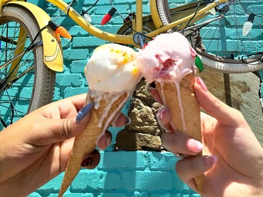 🌟 Where to get warm churros with ice cream in DFW: Scoop N’ Buns 🌟
Why we love it:
❤️ Scoop N’ Buns serves up delicious ice cream specialties at their super cool location!
❤️ They’re known for their warm air-fried churros with ice cream (SO GOOD) and glazed donut ice cream sandwiches. 🤤
❤️ You can also try their Filipino dessert, Halo Halo! This rainbow colored dessert includes shaved ice, fruits, ube halaya, jellies, and more. Definitely worth a try if you want to try something new and different!
❤️ Kids will love playing on the nintendo while they wait for their freshly air fried churros.
❤️ It’s beautiful and so fun.