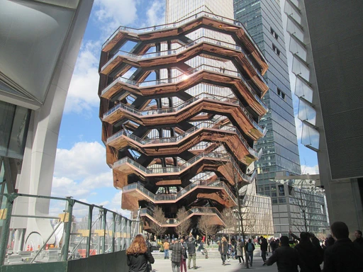 If you’re in NYC, be sure to check out the Vessel sculpture - it’s an iconic piece of modern architecture and a must-see destination! 🫶🏼🤍
Vessel is a structure and visitor attraction built as part of the Hudson Yards Redevelopment Project in Manhattan, New York City, New York. Built to plans by the British designer Thomas Heatherwick, the elaborate honeycomb-like structure rises 16 stories and consists of 154 flights of stairs, 2,500 steps, and 80 landings for visitors to climb. Vessel is the main feature of the 5-acre (2.0 ha) Hudson Yards Public Square. Funded by Hudson Yards developer Related Companies, its final cost is estimated to have been $200 million.