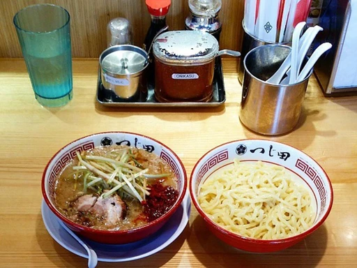 Jiro Style Ramen, right here in Los Angie.
At Tsujita Annex in West LA, Jiro-style ramen is a specialty that aligns with the authentic features of this style. Tsujita Annex is known for its rich, flavorful ramen and adheres closely to the traditional Jiro-style with its robust broth, substantial portions of toppings, and emphasis on a hearty, satisfying meal. The restaurant’s approach to Jiro-style ramen aims to capture the essence of the original while catering to the local palate.
— Jiro-style ramen is a distinct type of ramen that originates from Ramen Jiro, a famous ramen shop in Tokyo, Japan. It’s characterized by its hearty, rich, and indulgent style. The key features of Jiro-style ramen include a thick, flavorful broth, a heavy dose of garlic, a significant amount of bean sprouts, and a generous portion of fatty pork. The noodles are usually thick and chewy, and the dish is often topped with extra slices of pork and sometimes a raw egg.