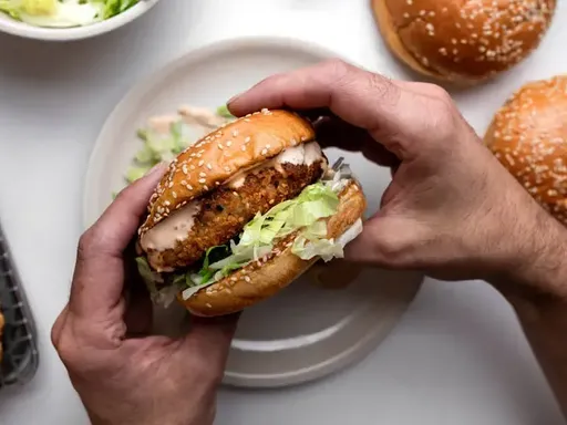 Chicken burger, Ookuma Japanese Burger
Crispy breaded chicken, a fistful of pickles, and a blanket of tartar sauce are all this burger needs. As I wrote previously, you can’t eat the burger without a mountain of napkins, thanks to the housemade tartar sauce loaded with chopped egg. Miraculously, the fried chicken stays crisp underneath. It’s a creamy summer delight, which is good, since seating here is in the great (shaded) outdoors.