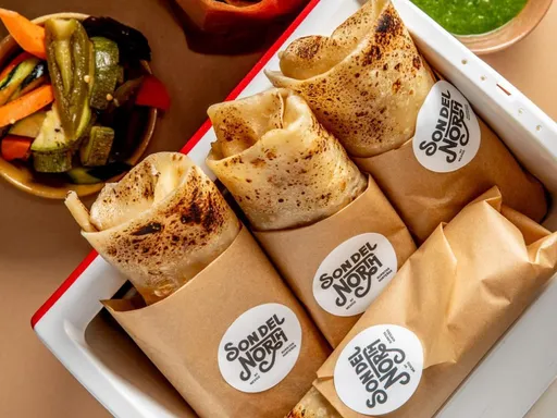 Son Del North
In places like Los Angeles, it’s much easier to find burritos without rice: Not so much in New York.
Son del North opened last month, a tiny takeout counter that’s already cementing itself as a welcomed addition to New York’s burrito scene, thanks in part to its homemade Sonora-style flour tortillas. The kitchen is under the direction of Annisha Garcia, from Tijuana, Mexico, who was the 2021 Chopped Grand Champion.