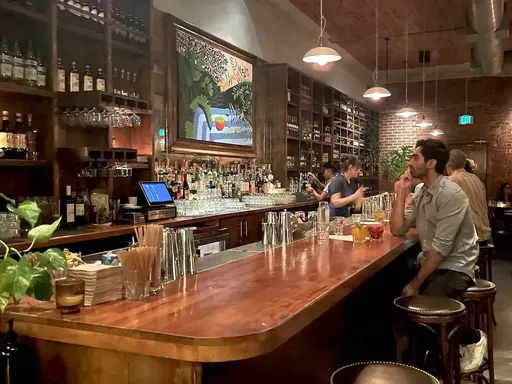 Nossa Caipirinha Bar
What: $10–11 cocktails and wines, $5–8 beers, discounted food items
When: Daily 4–6pm
Why we love it: After a short stint as a sit-down restaurant, this Brazilian eatery in Los Feliz flipped into a neighborhood watering hole inspired by the country’s botecos. Now, Nossa Caipirinha Bar offers five well-balanced renditions of its namesake drink—Brazil’s national cocktail—as well as a host of traditional bar snacks like cheese bread and coxinhas (chicken and paprika croquettes). At happy hour, snack on discounted bites like $9 chicken heart skewers, $14 fried calamari and $13 coxinhas.