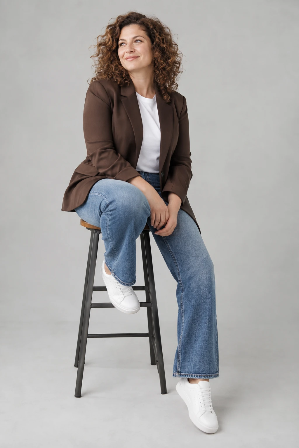 Chocolate Blazer with Relaxed Jeans and Trainers: chocolate blazer, white tee and relaxed blue jeans in chocolate, white and blue.