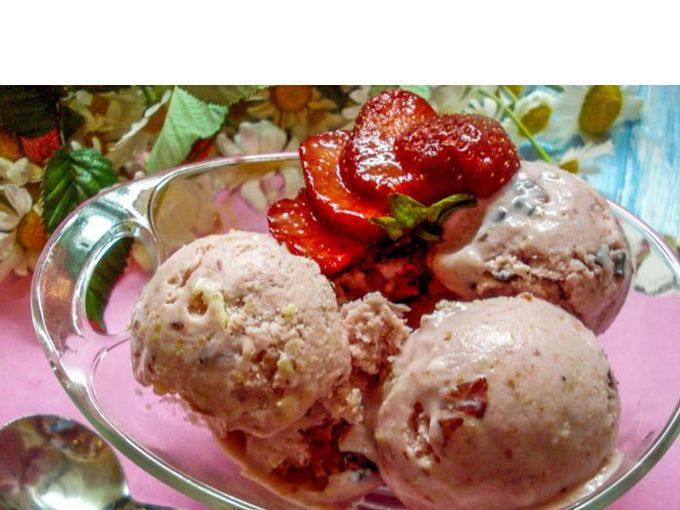 Homemade ice cream with berries, nuts and chocolate