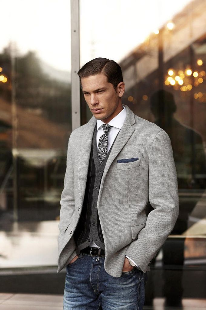 A cardigan worn under a jacket - layering can also be discreet and stylish