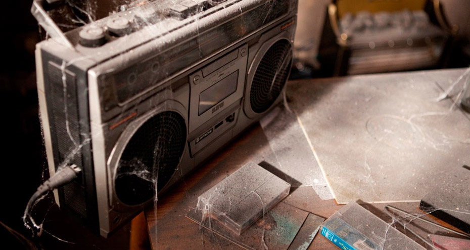 Cobwebs and radio on a dusty table courtesy of Dogwoof