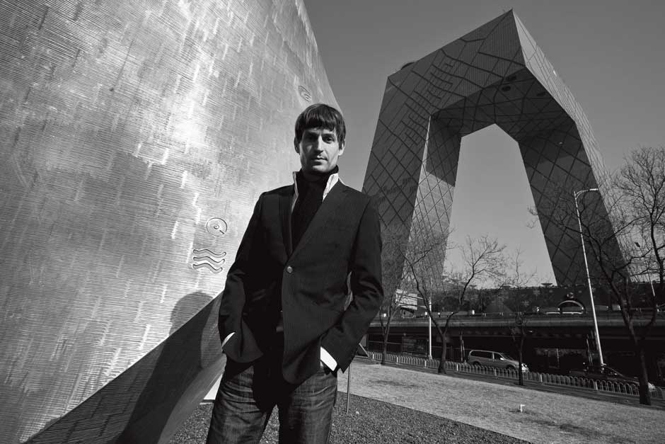 Architect Ole  Scheeren standing outside of the CCTV building in Beijing