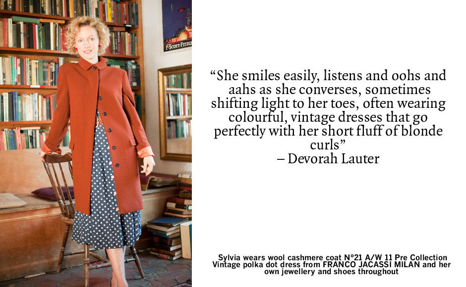 Sylvia Whitman, pictured in her Shakespeare & Co. bookshop. Credit: Sylvia wears wool cashmere coat No.21 A/W 11 Pre Collection vintage polka dot dress from FRANCO JACASSI MILAN and her own jewellery and shoes throughout