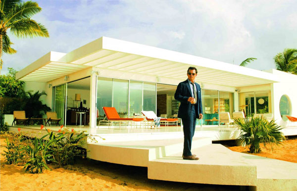 Johnny Depp in one of the film's promotional stills, dressed in a sharp 1950s tailored suit, holding a high ball glass outside his condo