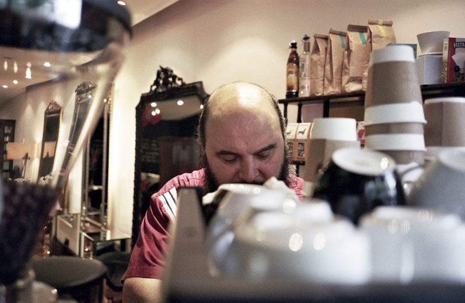 guven making coffee inside the salon