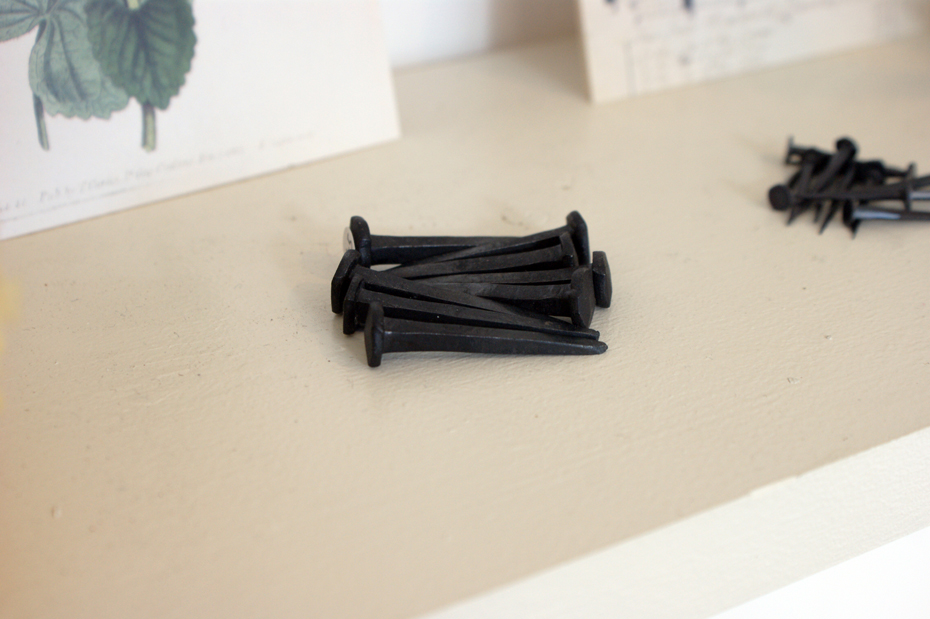 Handmade Swedish nails, J. Gilnert Handmade Swedish nails adorn the walls of J.Glinert, from these hang products displayed in well considered arrangements.