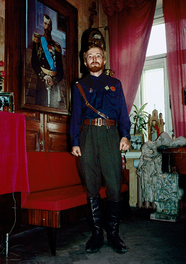 11/10/1991 — Moscow, Russian SFSR: A memeber of the political organisation Pamyat (Memory). Pamyat advocates preserving Russian culture and asserts that communism was a Jewish conspiracy. A portrait of Tsar Nikolai II and Russian orthodox icons decorate Pamyat's headquarters.