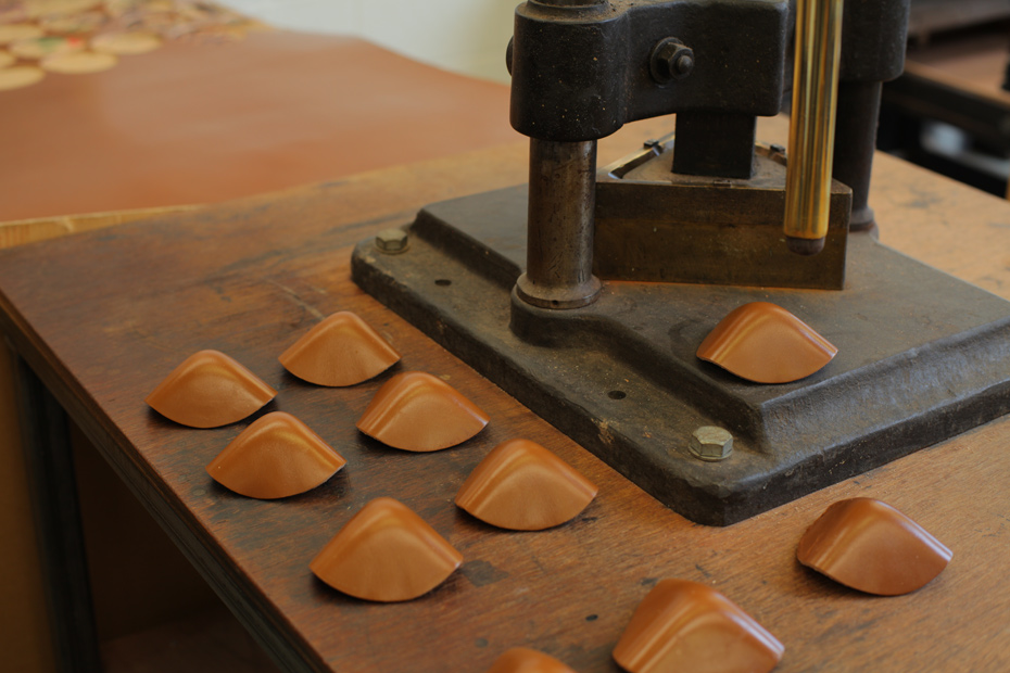 leather cornerings being made