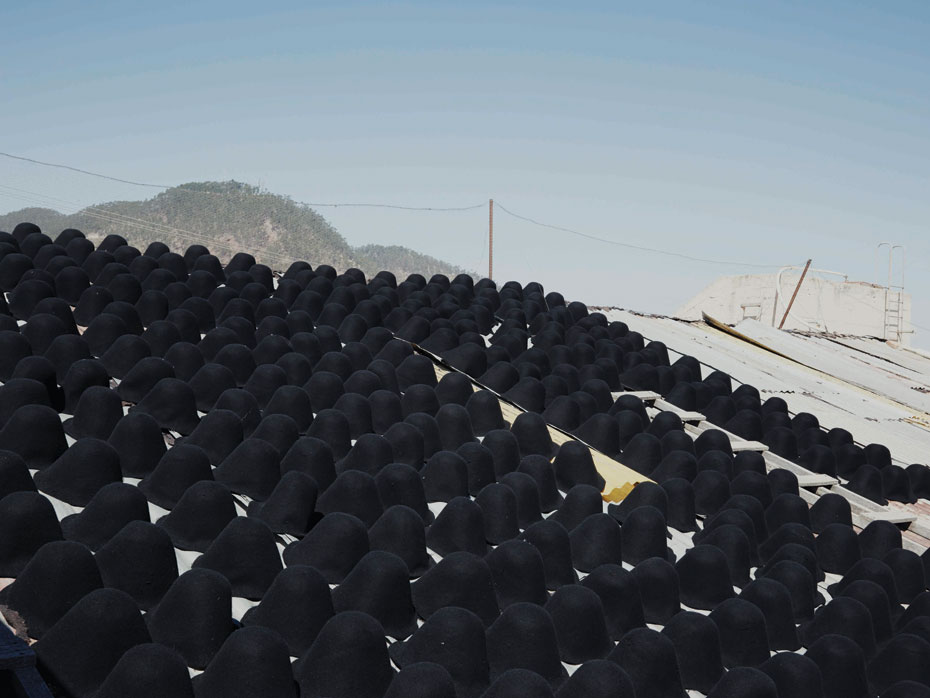 Nick Ballon_BOWLER Felt hat molds drying on the factory roof, Port 2013