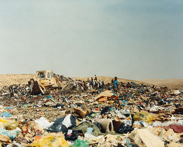 Children scavenging through a landfill site by Nick Waplington
