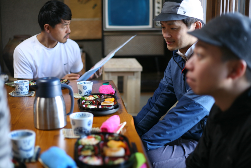 Members of the group sit down for a traditional lunch made of local cuisine during the tour