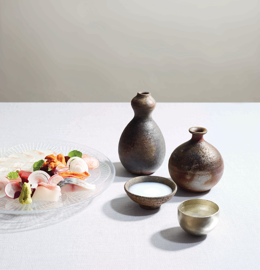 Omakase Sashimi prepared by Chef Yoshinori Ishii of Umu, with line-caught Cornish ikejime, streaked gurnard usuzukuri, stone bass, red mullet, mackerel, Icelandic sea urchin and toro. Plate: René Lalique ‘Coquille’ from 1910 Sakes: Bijofu Schwa (sparkling) Kamoizumi Nigori (cloudy/nigori) Kamoshibito Kuheiji Junmai Daiginjo 50 (regular) 