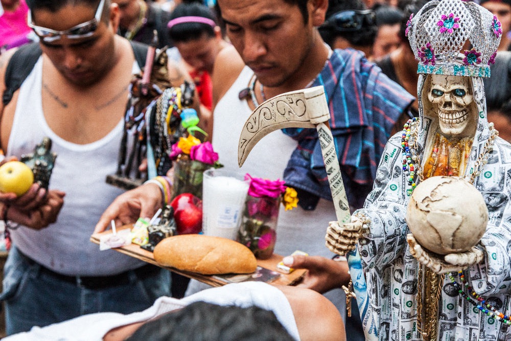 Santa Muerte devotees say prayers to the 'Skinny Lady' at the largest Santa Muerte service of the year in Mexico City