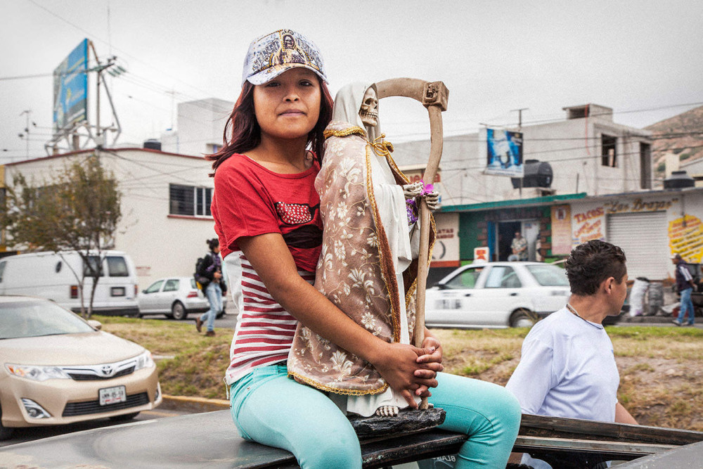 Young Santa Muerte devotee on street procession, Pachuca, Hidalgo State, Mexico, 2013