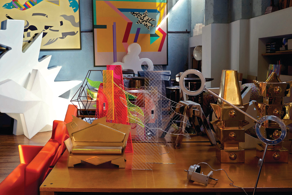 Atelier Mending is filled with colourful products and prototypes, including the Amuleto lamp in the foreground and the plastic K2 Loveseat for A Lot Of Brasil on the left.