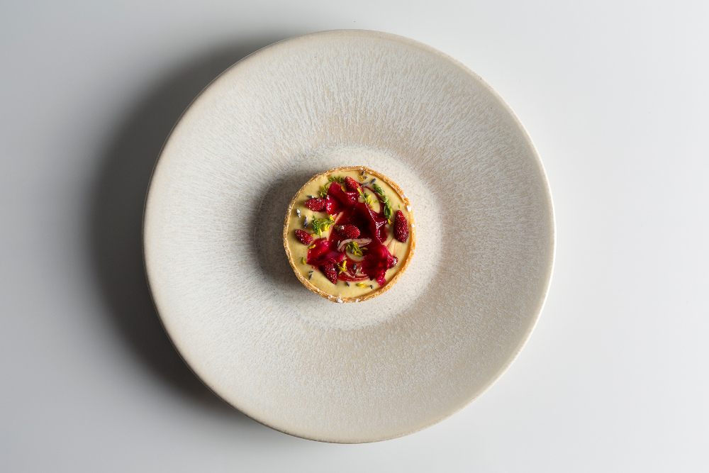 Wild strawberry tartlet with camomile & rose petals – photo by Joakim Blockstrom