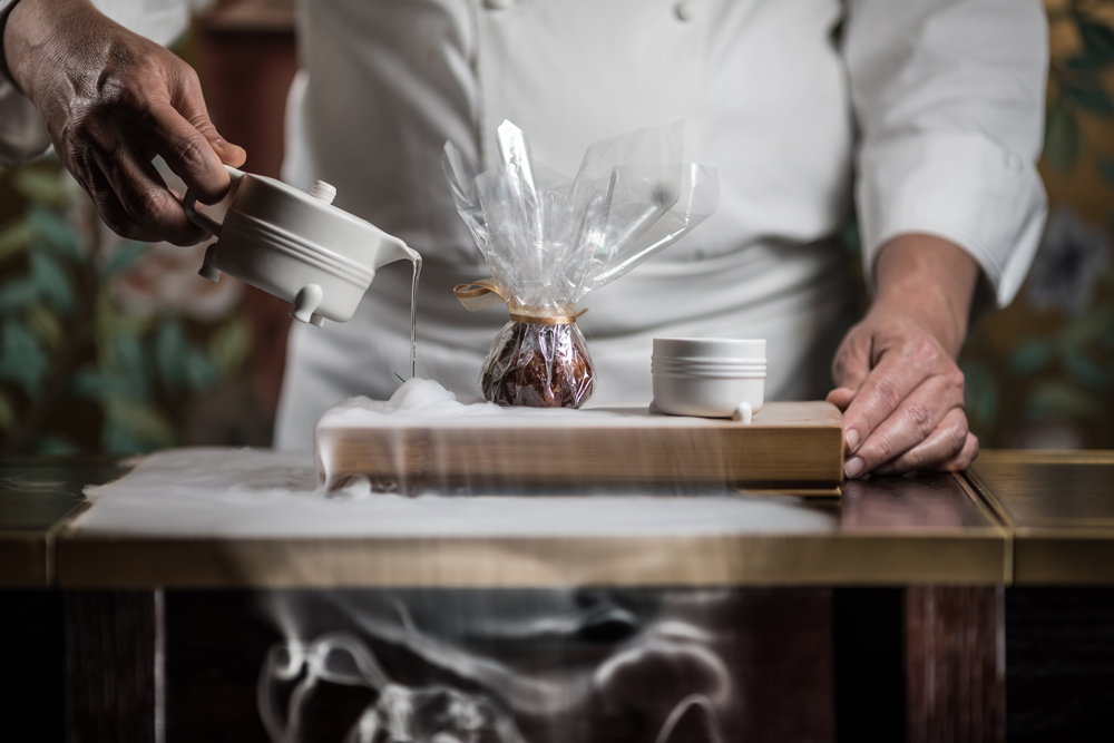 Chef Tong preparing 'Eight treasure chicken', with guinea fowl, ginko nut and mangalica ham