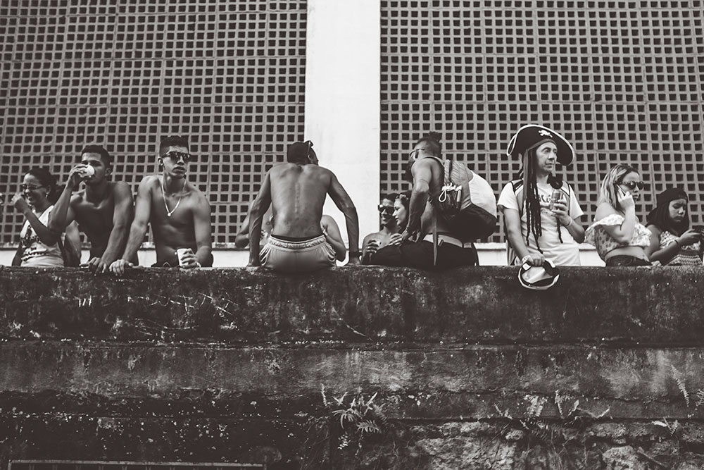 Onlookers watch the Carmelitas parade pass by from an elevated walkway in Santa Teresa