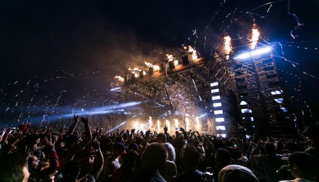 photograph of a festival concert and crowd at night