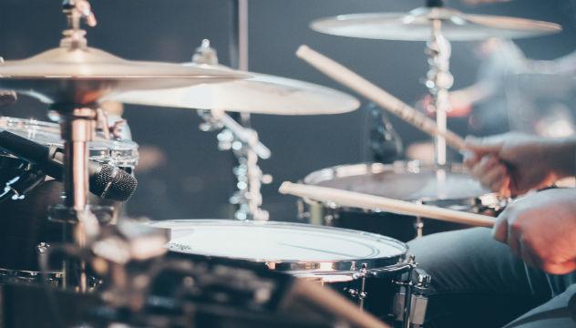 person playing the drums