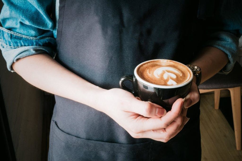 Barista Holding Latte